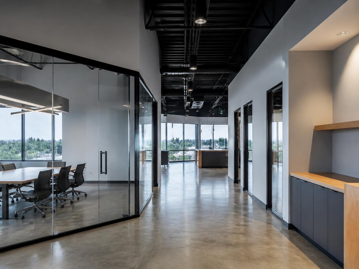Modern office tenant improvement with polished concrete floors and glass conference rooms
